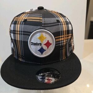 Pittsburgh Steelers New Era Black Plaid Snapback Hat.